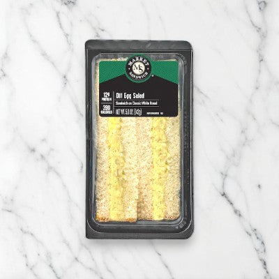E.A. Sween's Dill Egg Salad on Homestyle White Bread Sandwich Wedge features a tangy dill pickle relish and comes in a black plastic container. Ships frozen with a 30-day shelf life once defrosted.