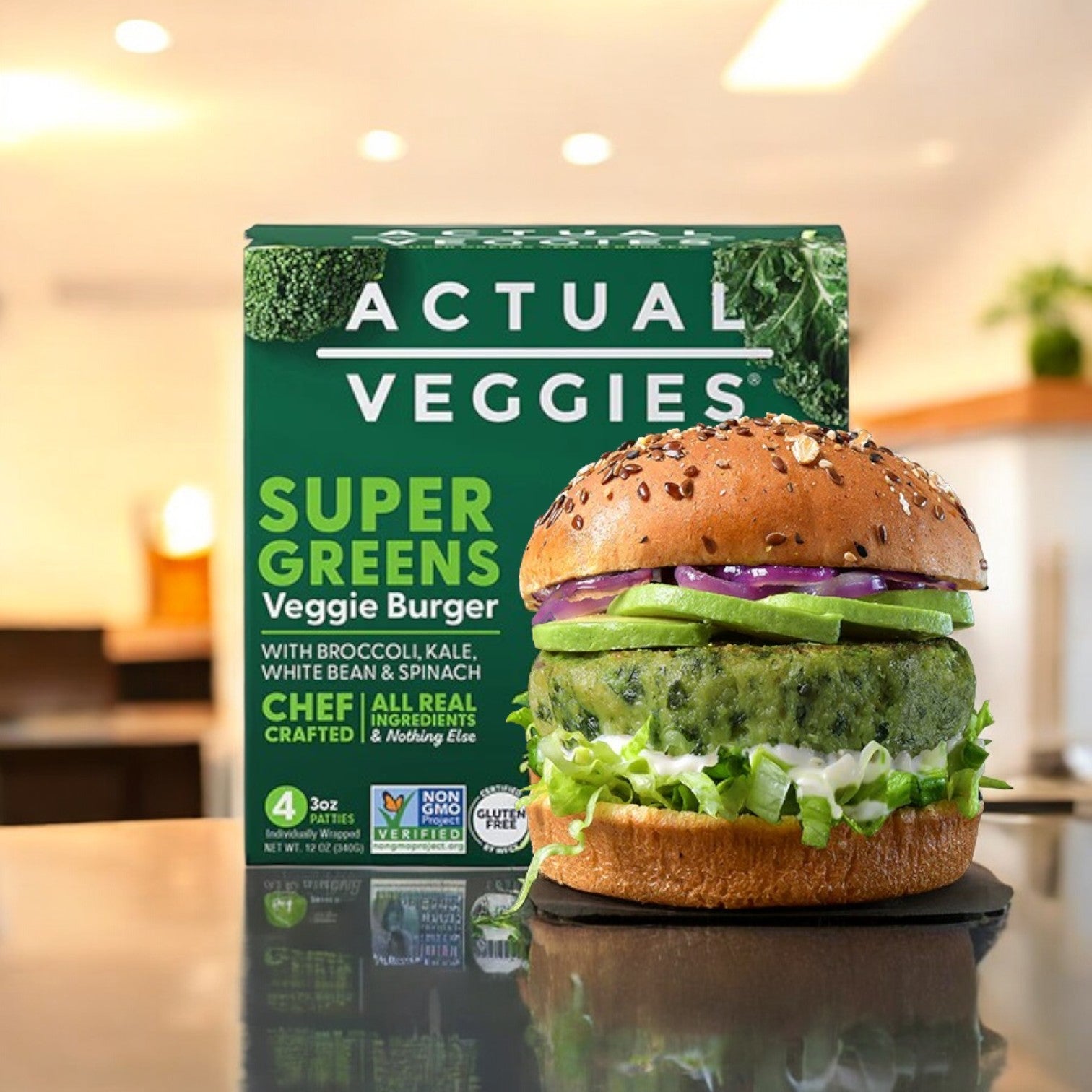 A veggie burger with lettuce, onions, and avocado is set before a box labeled "Actual Veggies 4 Pack Bundle," featuring four varieties of gluten-free and allergen-free veggie burgers, ideal for plant-based lifestyles. Perfect for veggie burger enthusiasts!.