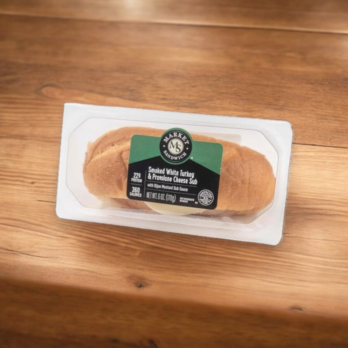 The E.A. Sween Smoked White Turkey & Provolone Cheese Sub, available in a case of 10 and shipped frozen, sits invitingly on a wooden surface with a 30-day shelf life once refrigerated.