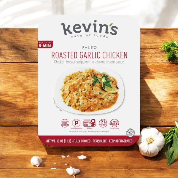 Kevin's Roasted Garlic Chicken packaging highlights quick prep, gluten-free, soy-free, and low sugar benefits. Adorned with garlic and herbs, this keto-friendly choice offers a 16 oz. pack that ships frozen with a 30-day shelf life once chilled.