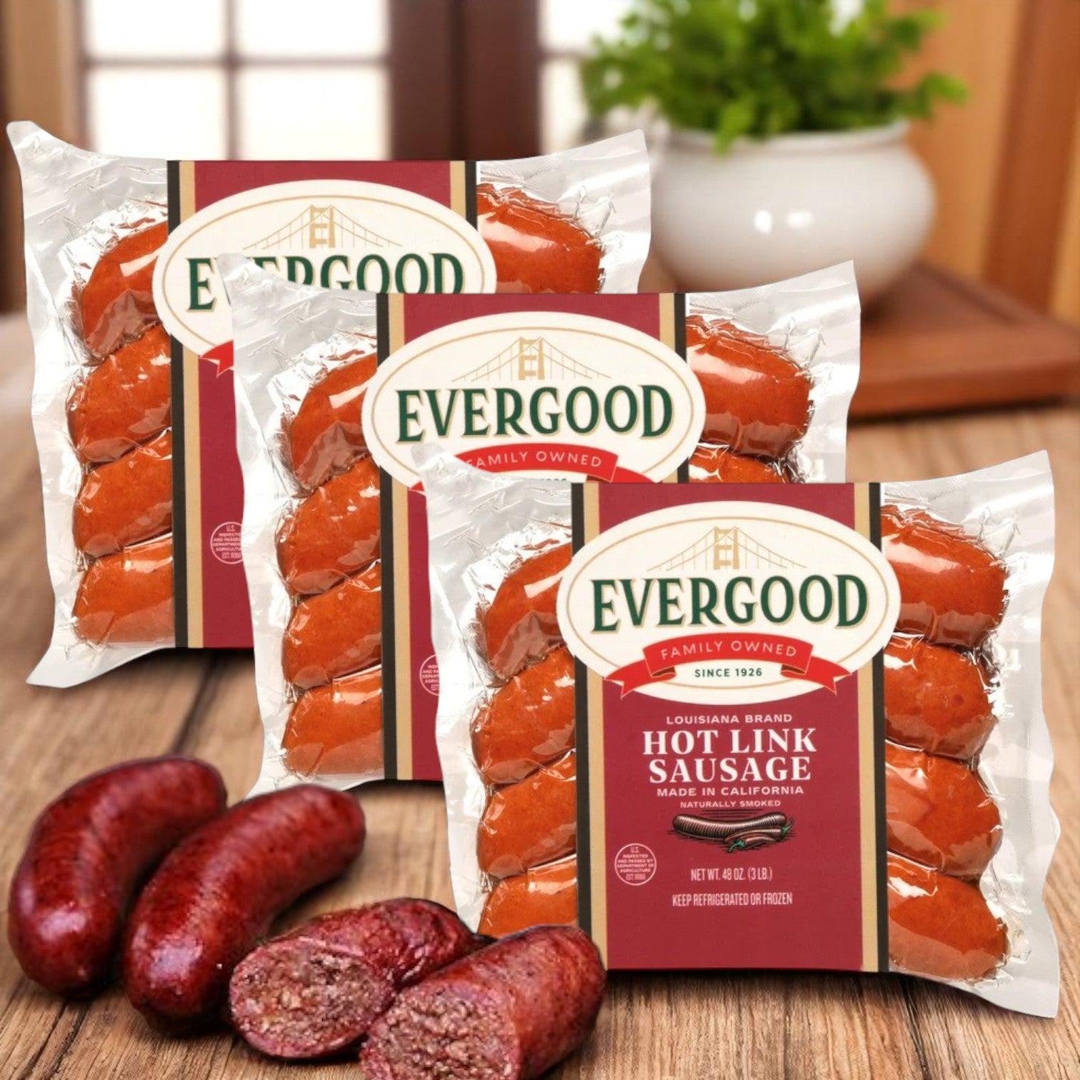 Three packs of Endless Market Evergood Louisiana Brand Hot Link Sausage (36 links, 9 lbs total) are displayed with sliced, naturally smoked sausages in front, set against a blurred indoor background.