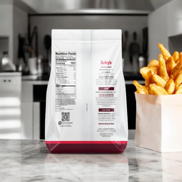 A bag of Arby's Curly Fries, Seasoned, - 1 Count sits on the counter next to a carton. The fries are enticingly spiced, with nutritional details visible on the bag.