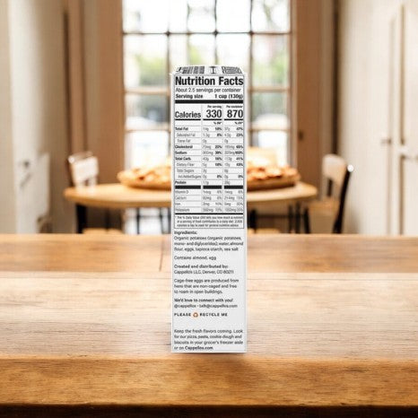 The nutrition facts panel of Cappello's Gnocchi Pasta sits on a wooden table, surrounded by a charming dining setup, hinting at a health-conscious feast similar to enjoying almond flour delicacies.
