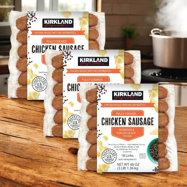 Displayed are packages of Kirkland Signature Parmesan Black Pepper & Parmesan Chicken Sausage, 3 Count. A stovetop with a pot serves as the background.