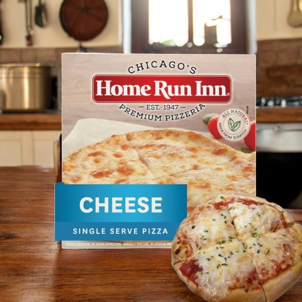 Box of Home Run Inn Mini Personal Pizza, Classic Frozen Cheese Pizza, 7.5 oz. - 3 Count, with a slice highlighting its buttery flaky crust in a kitchen setting.