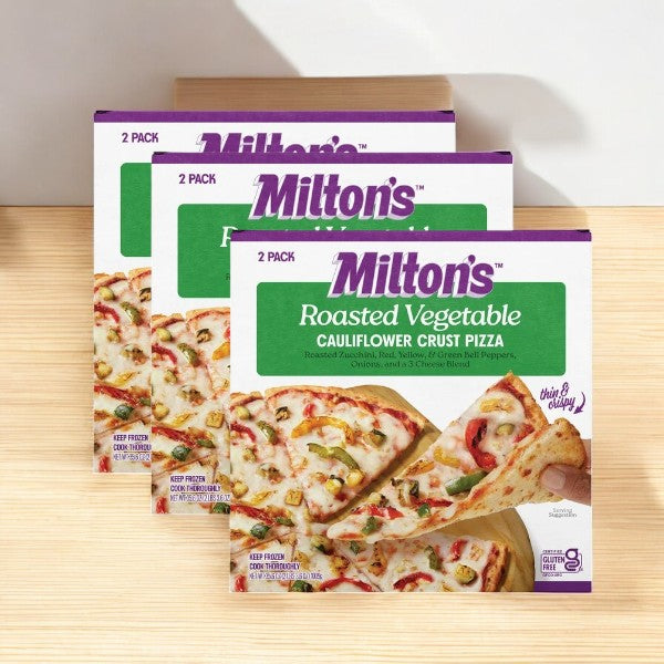 Three boxes of Milton's Cauliflower Crust Pizza, Roasted Vegetable (35.6 oz per box), are stacked on a surface, with each box containing two pizzas.