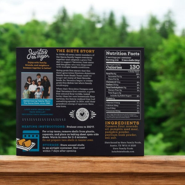 The Siete Taco Shells package includes nutrition facts, ingredients, heating instructions, a family story with a photo labeled "Embarrassing Family Photo circa 2015," and highlights that these grain-free shells are gluten-free for dietary peace of mind.