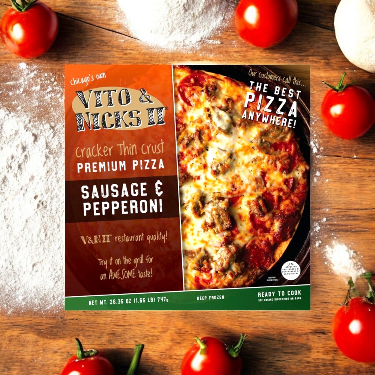 The Vito & Nick's Cracker Thin Crust Sausage & Pepperoni Pizza box sits on a wooden table with tomatoes and flour, highlighting the classic Chicago Tavern-Style pizza essence.