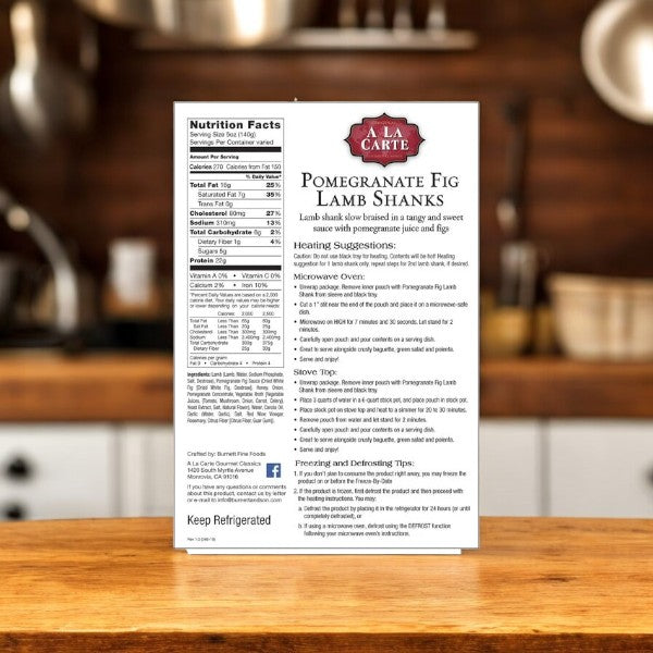 A box of A La Carte Pomegranate Fig Lamb Shanks, 2 Count-1 Pack, sits on the kitchen counter. The package displays nutrition facts, heating instructions, and ingredients—each promising a unique culinary experience with tender lamb in every savory bite.