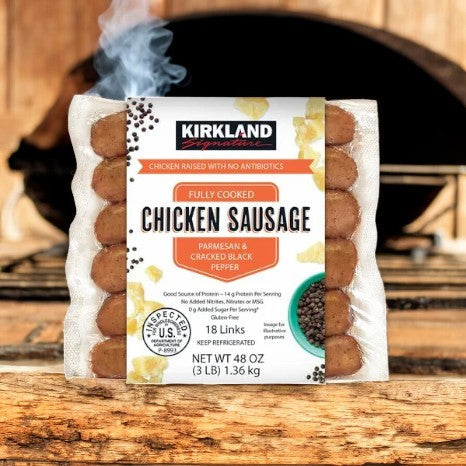 A pack of Kirkland Chicken Sausage- Signature Parmesan Black Pepper & Parmesan, by Kirkland Signature, sits enticingly on a wooden background. It offers 18 flavorful links and a total weight of 48 oz, providing a protein-rich meal with its savory parmesan and black pepper taste.