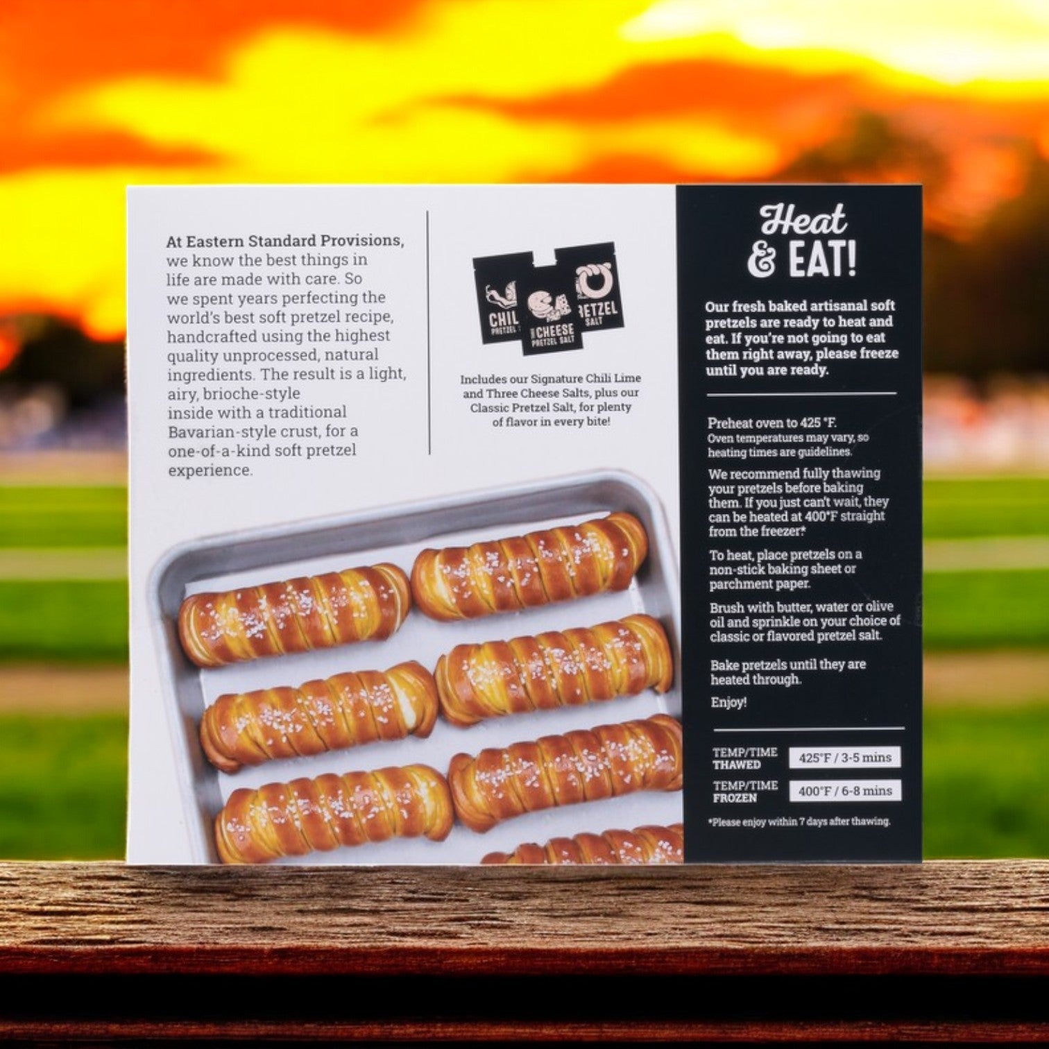 A display of Eastern Standard Provisions' Soft Artisanal Turnbuckle Pretzels features seasoned pretzels on a tray, with simple prep instructions and an enticing image.