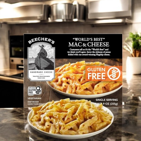 A single serving of Beecher's Handmade Cheese "World's Best" Gluten Free Mac & Cheese, featuring natural ingredients and their famous Flagship cheese, is presented attractively in a kitchen.