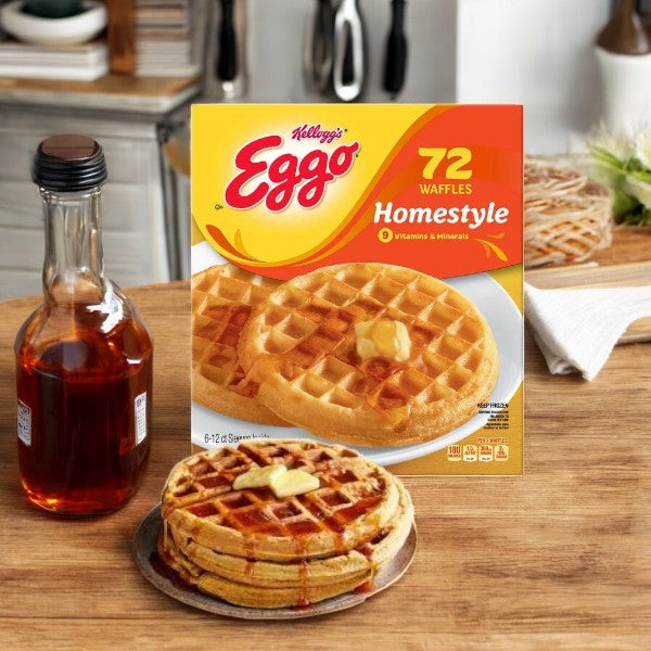 A pack of Kellogg's Eggo Waffles, Homestyle, 72-count, rests beside a syrup-drizzled stack on a cozy kitchen counter.