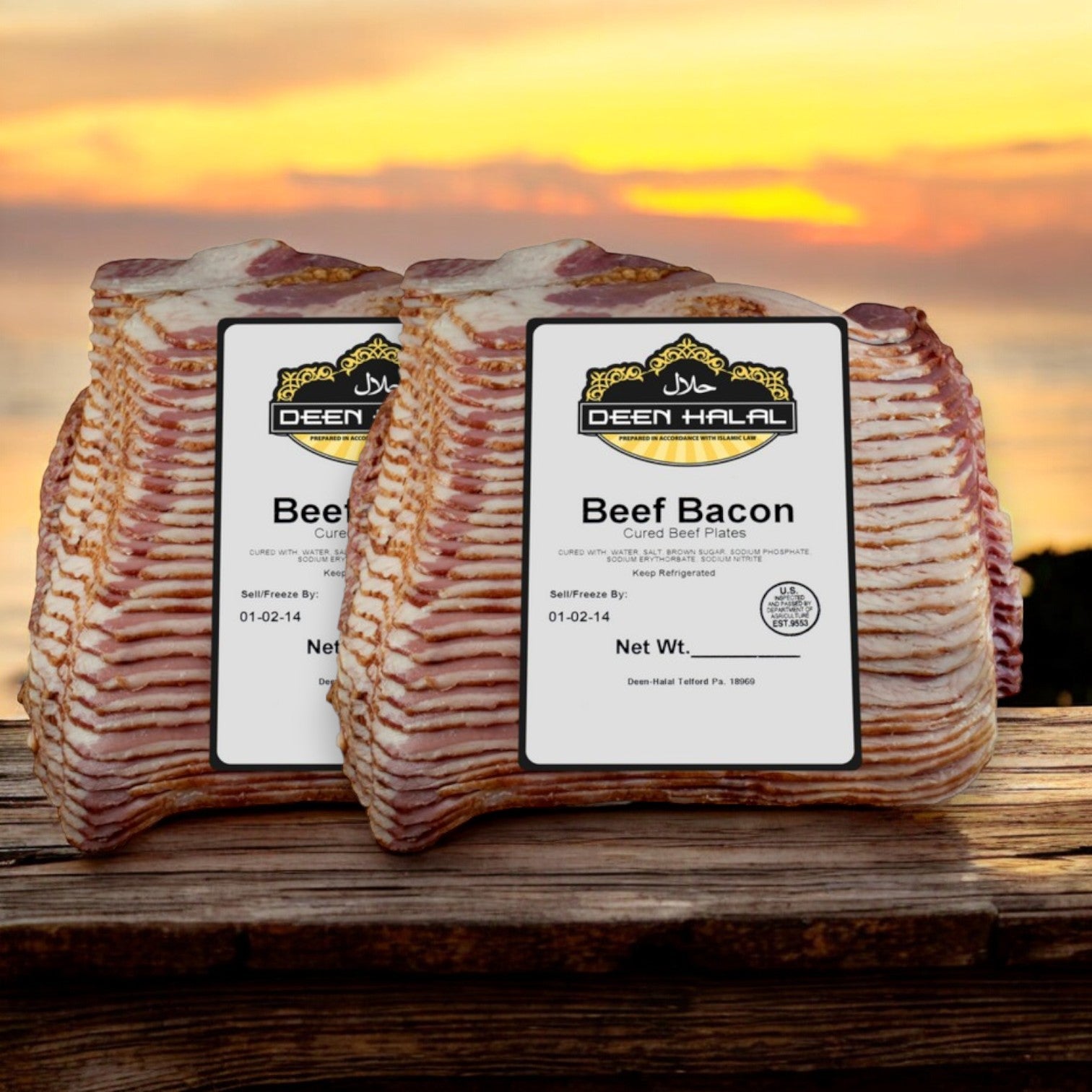 Two Deen's Halal Sliced Beef Bacon, each 10 pounds and famous for their smoky flavor, rest against a sunset background on a wooden surface.
