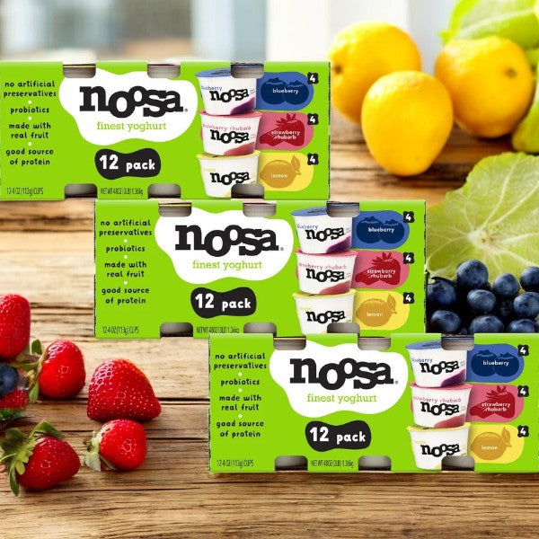 Displayed are three packs of 12 oz Noosa Yoghurt Variety Pack, each featuring flavors like strawberry, raspberry, and blueberry alongside fresh berries. Enjoy this 4-count probiotic-packed snack for a tasty and wholesome treat.