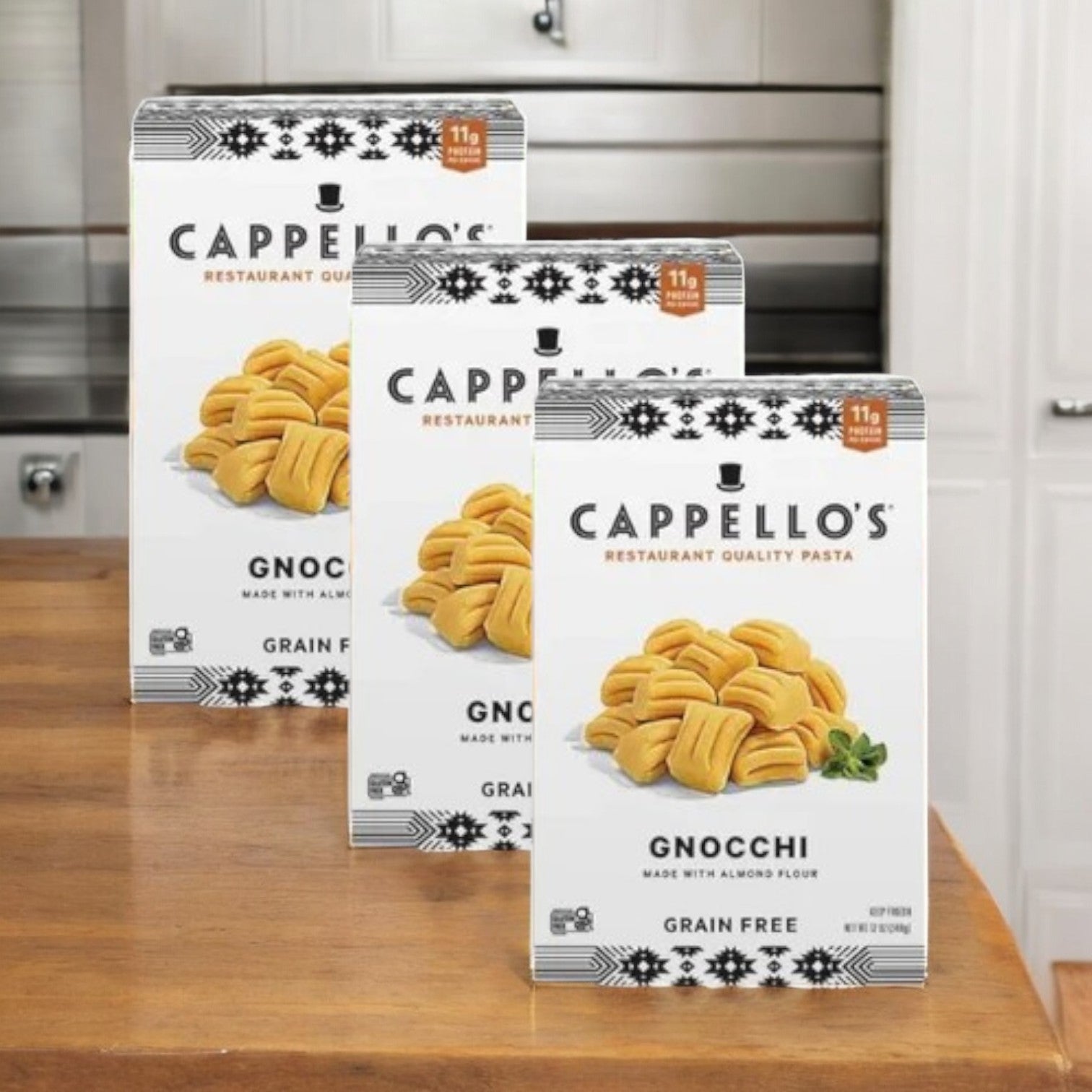 Cappello's Gnocchi Pasta- 3 Count, made with almond flour and gluten-free, is stylishly presented on a wooden kitchen counter against white cabinets, offering an excellent paleo-friendly pasta option for your culinary adventures.
