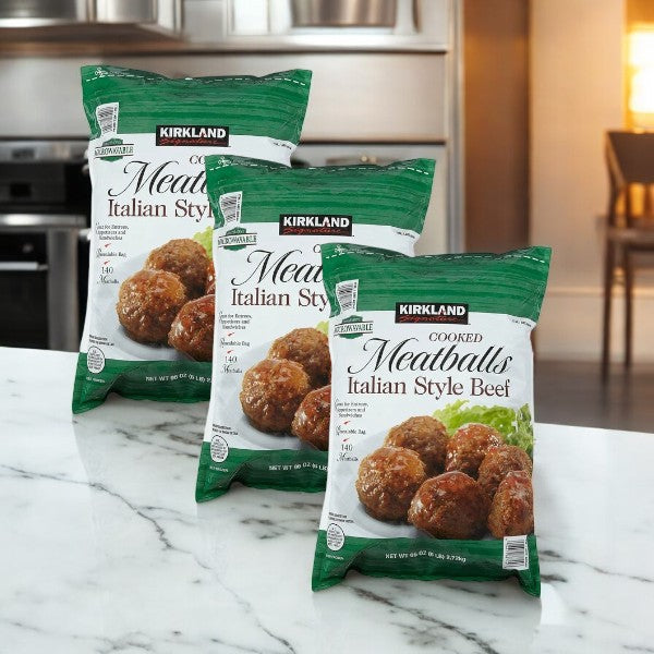 Three bags of Kirkland Signature Meatballs (6 lbs each, 18 lbs total) are displayed on a marble countertop in a kitchen.