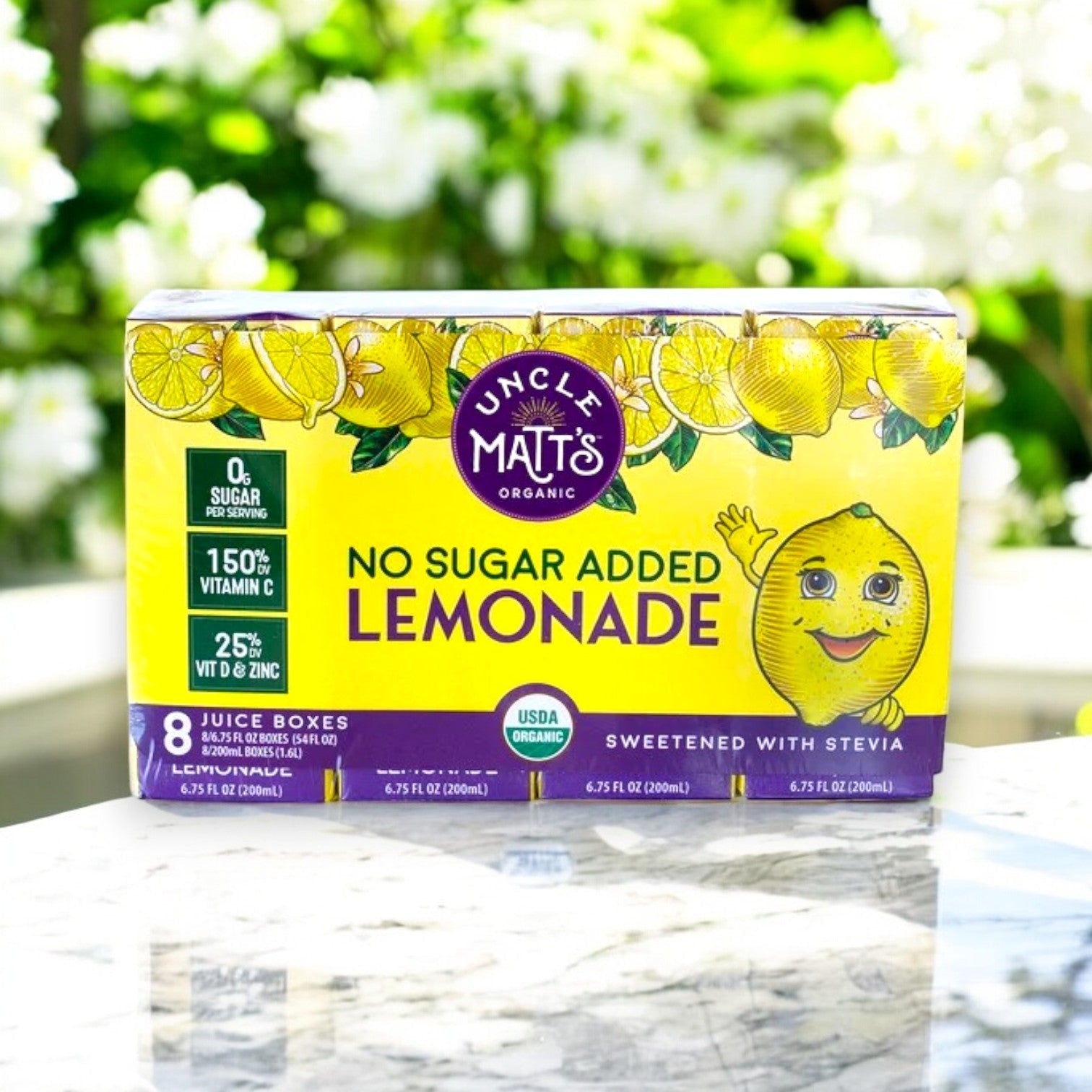Uncle Matt's Organic No Sugar Added Lemonade Juice Boxes, 6.75 fl oz (8-Pack), highlight Immune Support with vitamin C and zinc, featuring a smiling lemon design and proudly displaying "No Added Sugar.