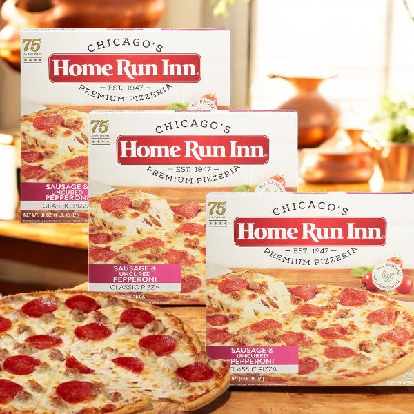 Three boxes of Home Run Inn Family Size Classic Frozen Sausage and Uncured Pepperoni Pizza, 31 oz., with a cooked pizza featuring a homestyle crust in front.