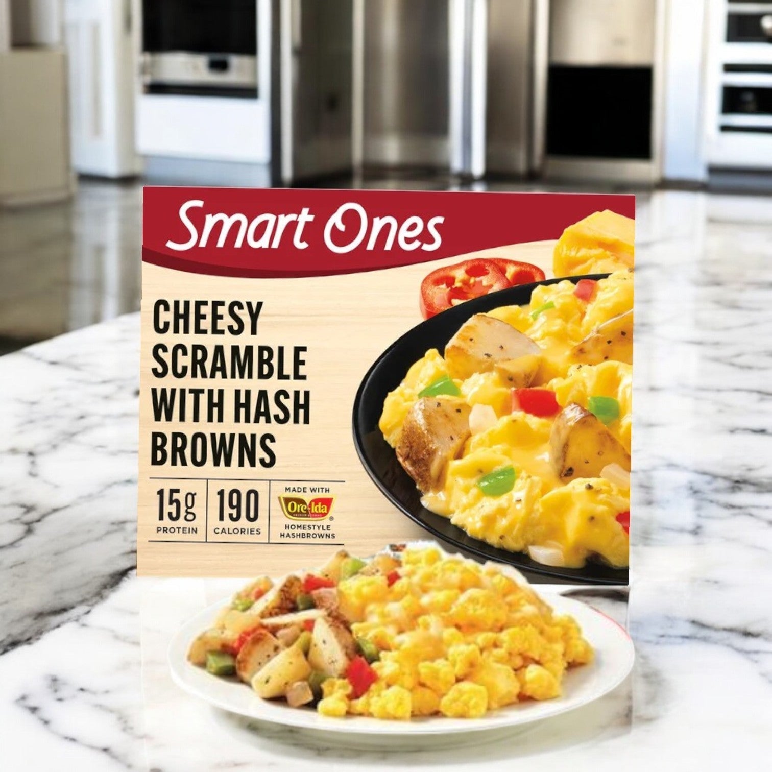 A box of Smart Ones Hash Browns, Eggs & Cheddar, Monterey Jack & Mozzarella Cheeses Frozen Meal on a marble countertop highlights the ease of microwaveable meals like their Three Cheese Ziti Marinara.