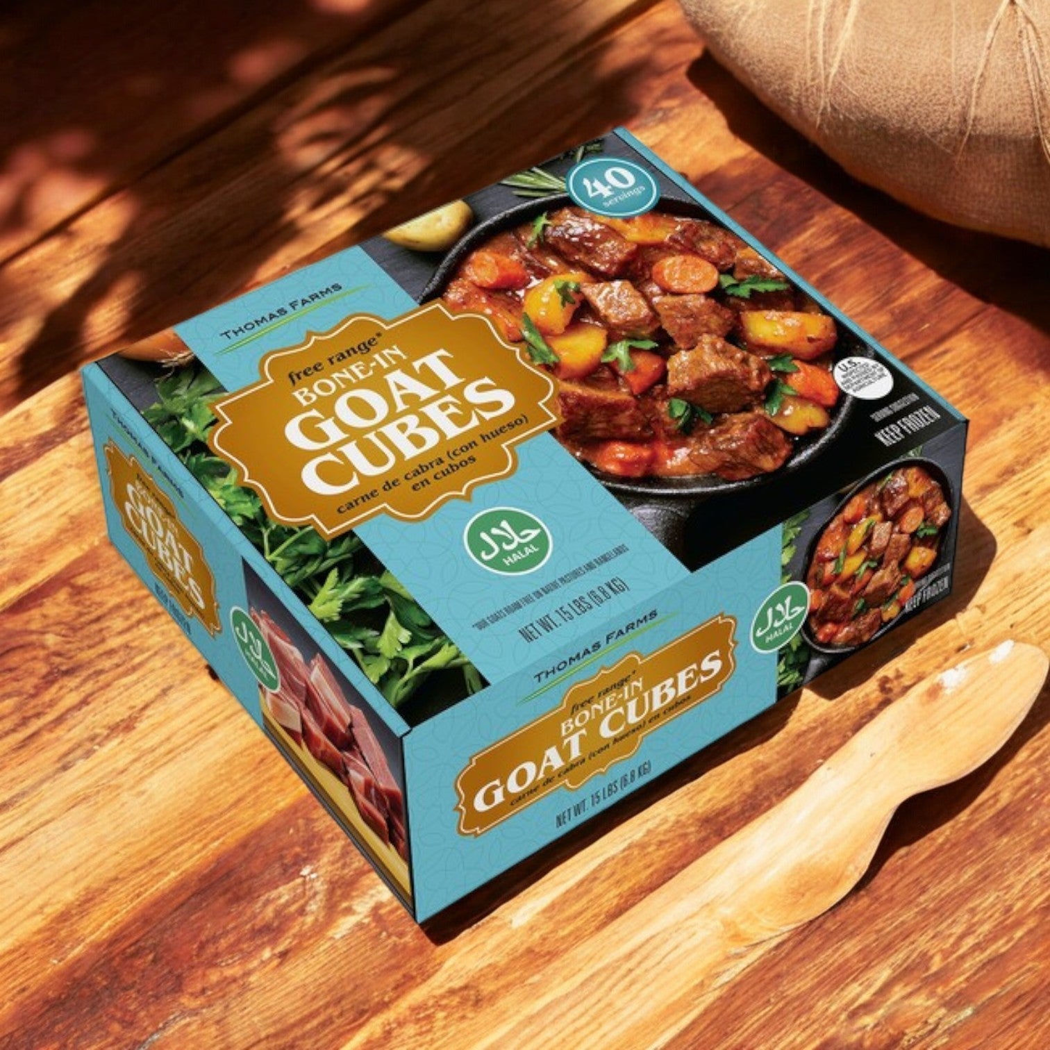 A package of Easy Lunches Thomas Farms Halal Bone-In Goat Cubes (2" x 2", 15 lbs total in 2 lb packs) is showcased on wood with a wooden spoon. The packaging highlights halal certification and an image of tasty cooked goat cubes, ensuring premium halal goat meat.