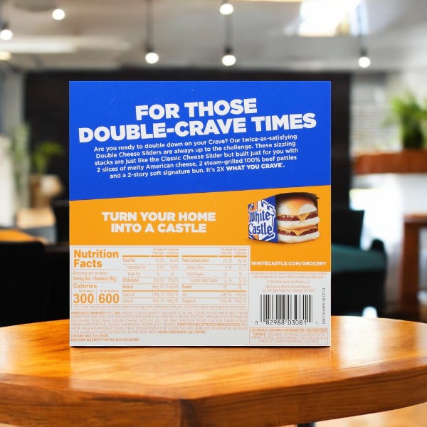 The back of a White Castle Sliders, Double Cheese- 3 Count box shows cooking instructions and nutrition facts. It highlights its iconic steamed bun and seasoned beef patty, set on a blurred table with plants and soft lighting in the background.