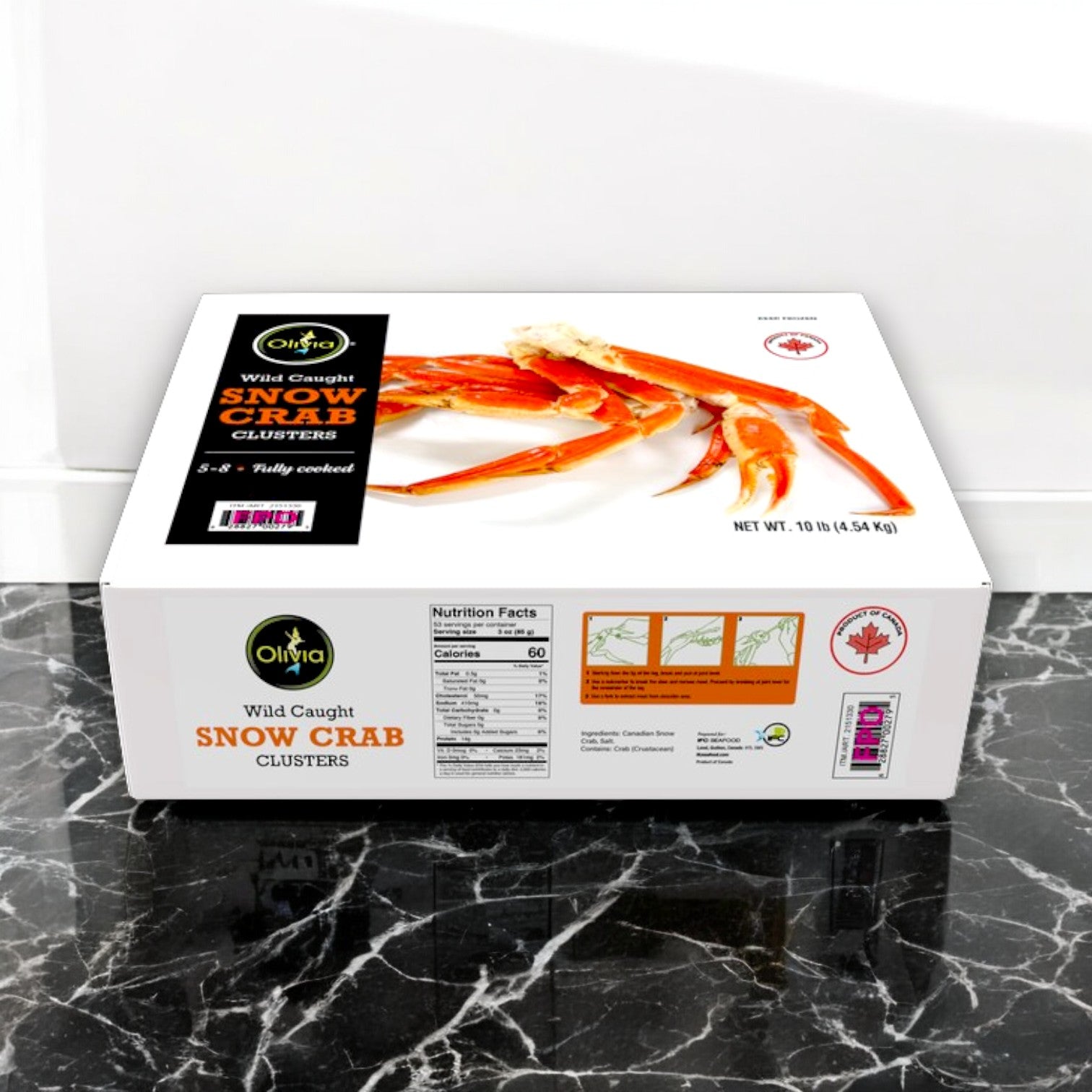 A 10 lbs box of Olivia Wild Caught Snow Crab Clusters by IFC Seafood sits on a marble surface, featuring enticing images of cooked crab legs and nutritional information.