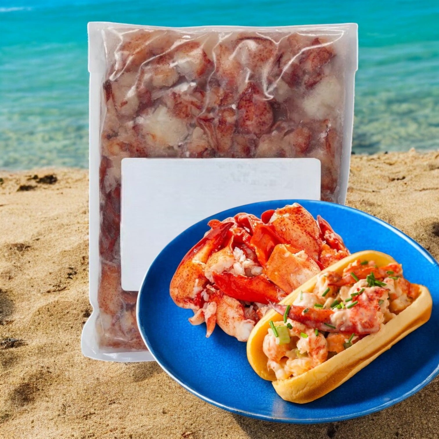 A vacuum-sealed bag of Easy Lunches' Maine Lobster Meat Claw and Knuckle-4 Pounds rests on the sand by the ocean, next to a blue plate featuring a lobster roll piled high with extra gourmet seafood.