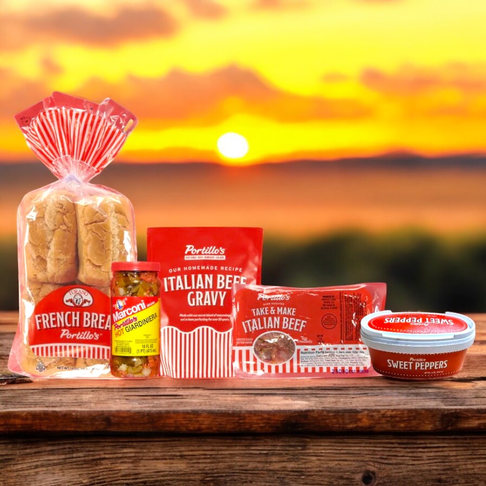 A Chicago-style feast is artfully displayed as Portillo's 8 Italian Beef Sandwich Combo & Lou Malnati's Pizza Cheese! by Easy Lunches showcases ingredients like bread, giardiniera, gravy, beef, and sweet peppers on a wooden surface against a stunning sunset.