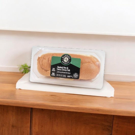 A beautifully labeled "Smoked Ham & Swiss Cheese Sub" from E.A. Sween rests invitingly, showcasing its delicious promise.