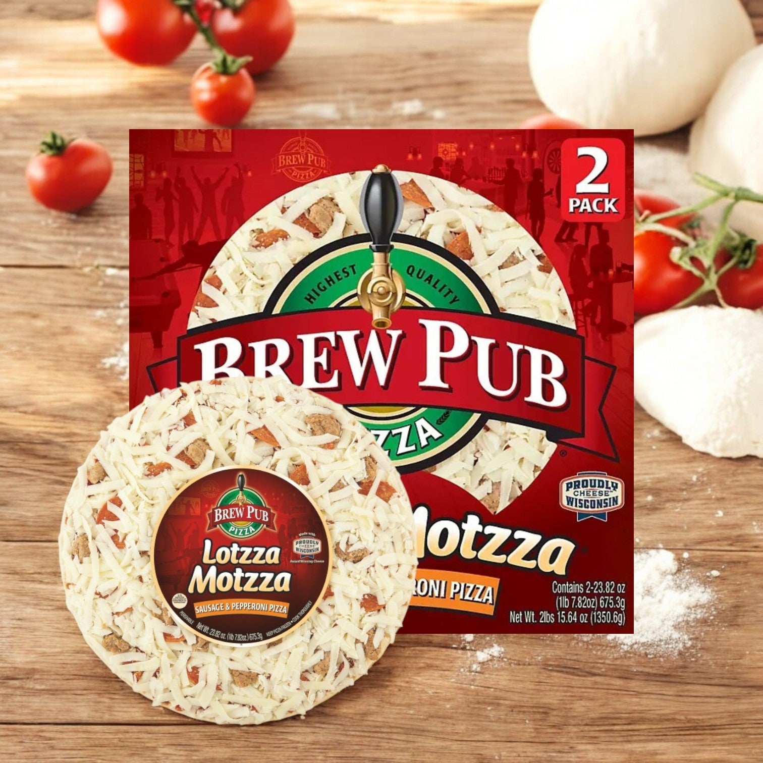 Bernatello's Brew Pub Lottza Motzza Sausage and Pepperoni Pizza, Frozen, 2 Pizzas Per Box, sits on a wooden surface with its irresistible Wisconsin mozzarella cheese layer while fresh tomatoes and pizza dough create an appetizing background.