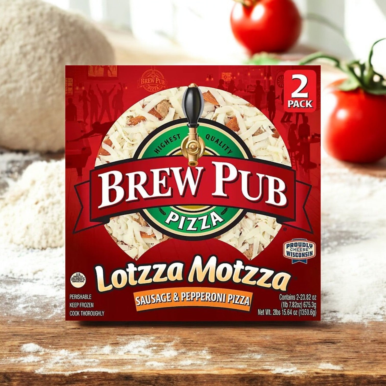 A box of Bernatello's Brew Pub Lottza Motzza Sausage and Pepperoni Pizza, frozen with 2 pizzas per box, sits on the countertop surrounded by tomatoes and flour. Made with rich Wisconsin mozzarella cheese, this delightful pizza is ideal for any occasion.