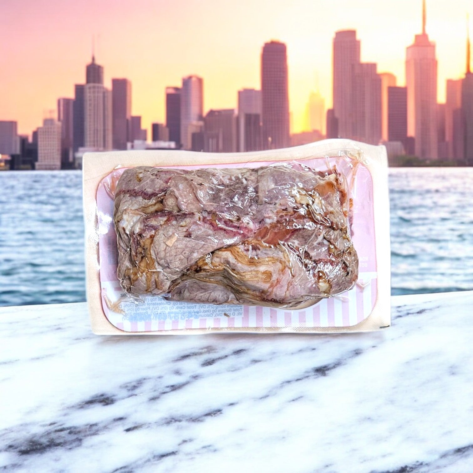 Portillo's Italian Beef Gravy and beef sit on a marble surface, evoking Chicago-style Italian beef sandwiches, with a city skyline and shimmering water in the background.