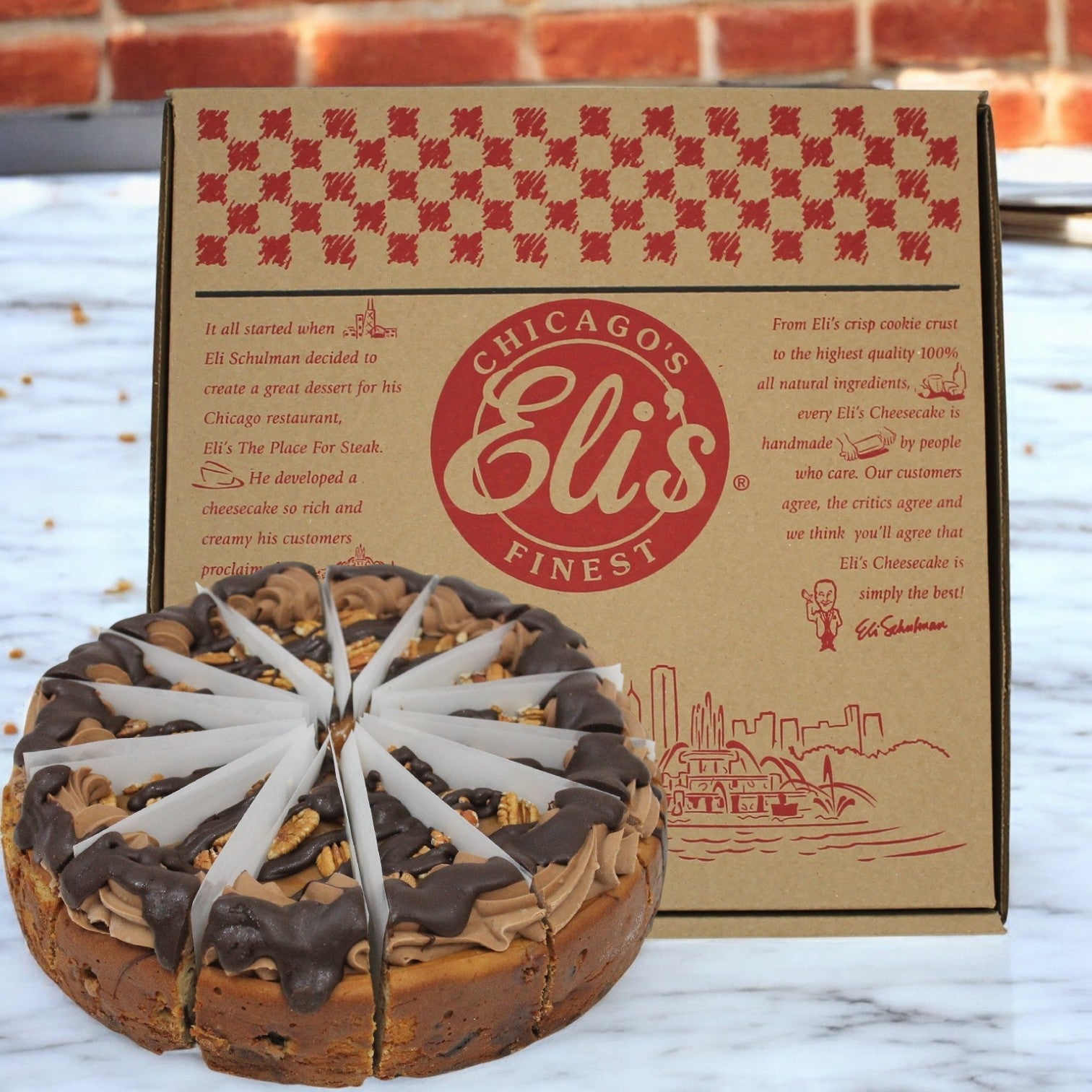 Savor Eli's Cheesecake with the Turtle Cheese Cake, featuring decorative white chocolate slices. This 10" round dessert is a true Chicago delight, offering indulgence in every bite. Each case includes two of these masterpieces.