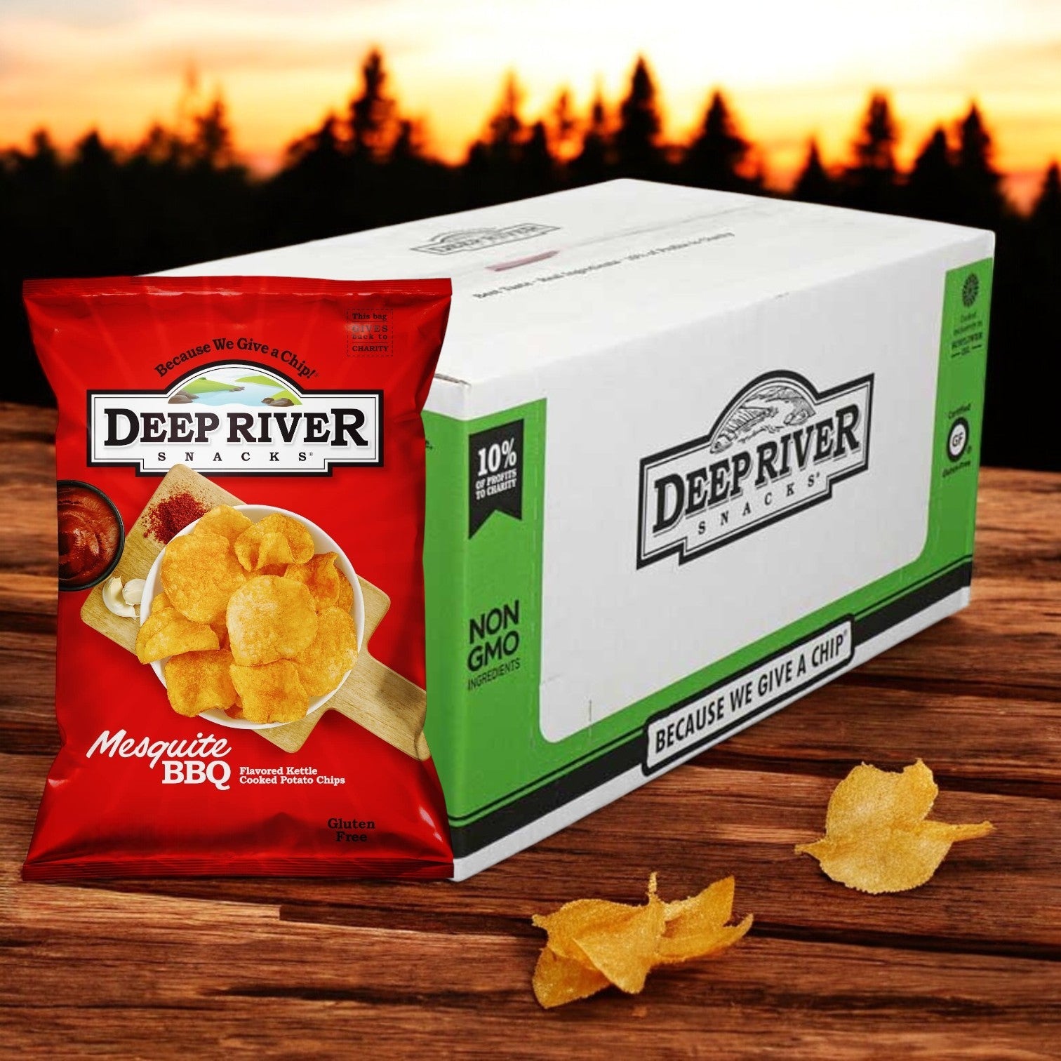 A 1.375-ounce bag from a 48 per case of Deep River Snacks Mesquite BBQ Kettle Potato Chips sits on a wooden surface with a sunset backdrop, showcasing its gluten-free smoky flavor, ideal for any snack enthusiast.