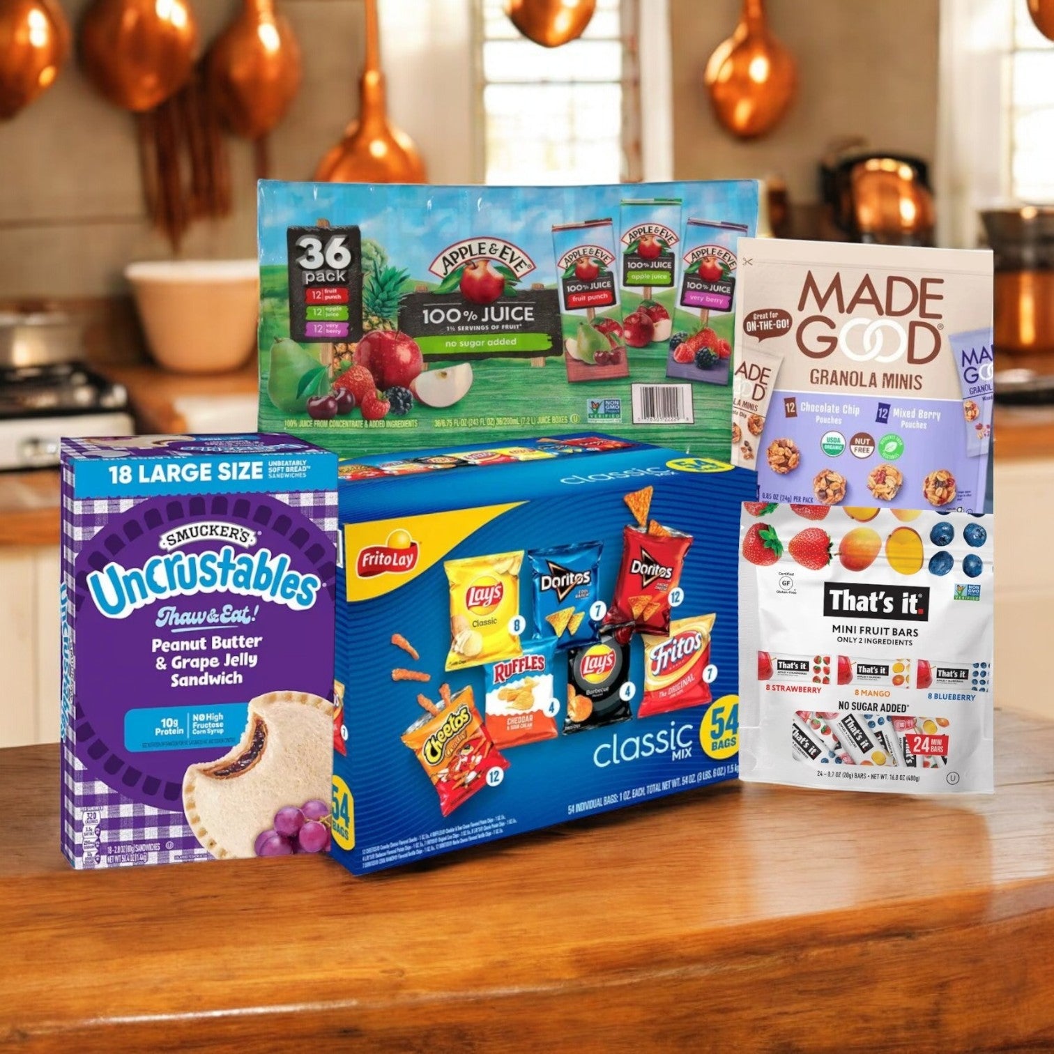 The Easy Lunches Kids Lunch Bundle features drinks, sandwiches, chips, and granola minis—perfect for school lunches. Enjoy free shipping on this delightful snack box assortment on your kitchen counter!.