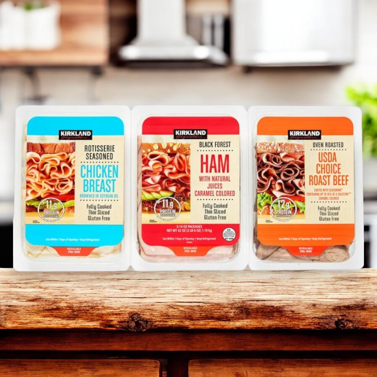 An image showcases Kirkland Signature Variety Lunch Meat Pack featuring Rotisserie Seasoned Chicken Breast, Black Forest Ham, and USDA Choice Roast Beef on a wooden table. Each protein-rich selection is in clear plastic containers with colored labels, ideal for charcuterie boards.