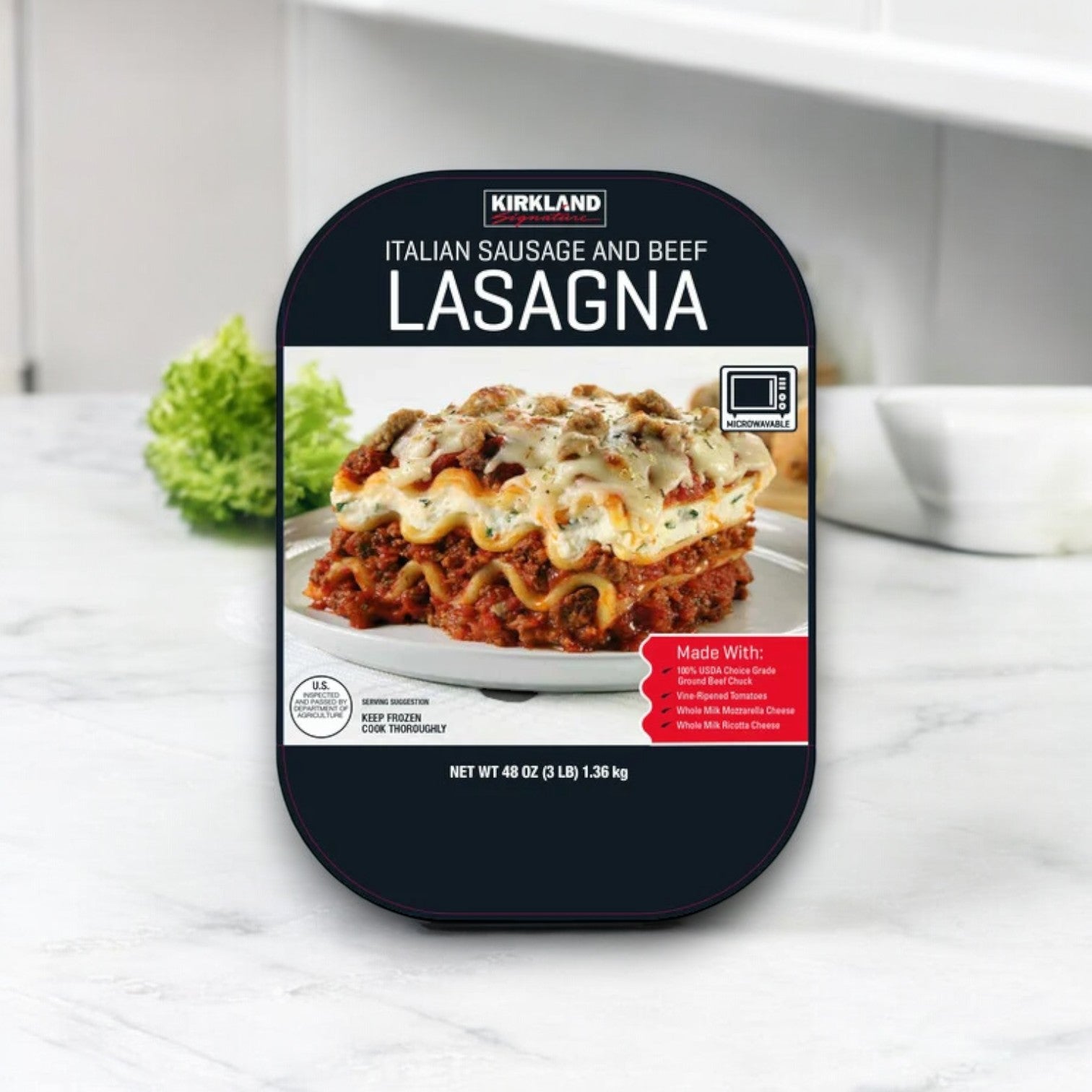 The Kirkland Signature Italian Sausage and Beef Lasagna, with its 3 lbs packaging in a convenient 2-count pack, rests on the countertop as a perfect meal solution that saves time. The image of this delicious dish highlights its premium ingredients, promising to tantalize your taste buds.