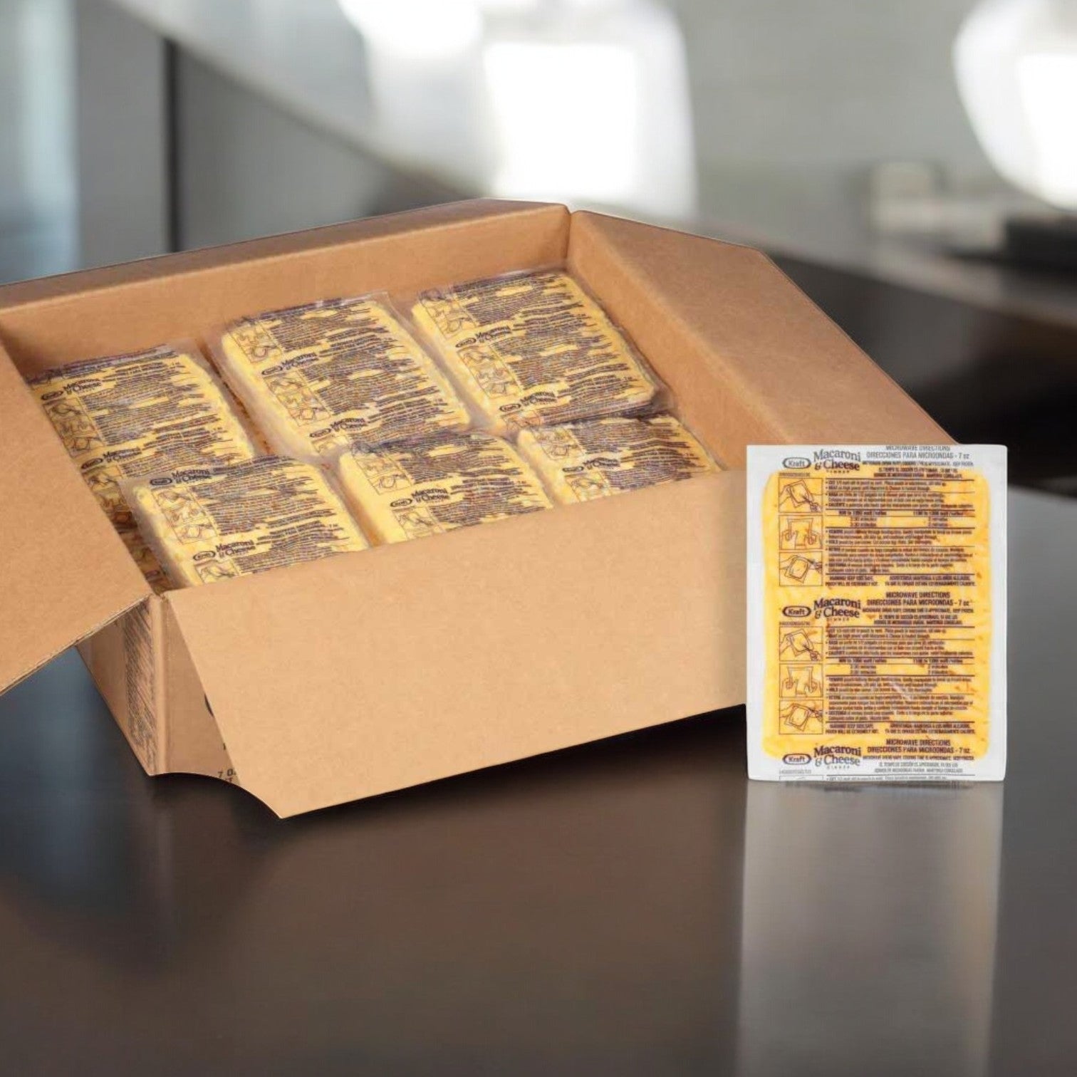 A cardboard box contains several packets of printed information sheets on a reflective surface, similar to how Kraft Frozen Entree Macaroni and Cheese, 7 oz., 36 Packs, organizes its delicious meals.