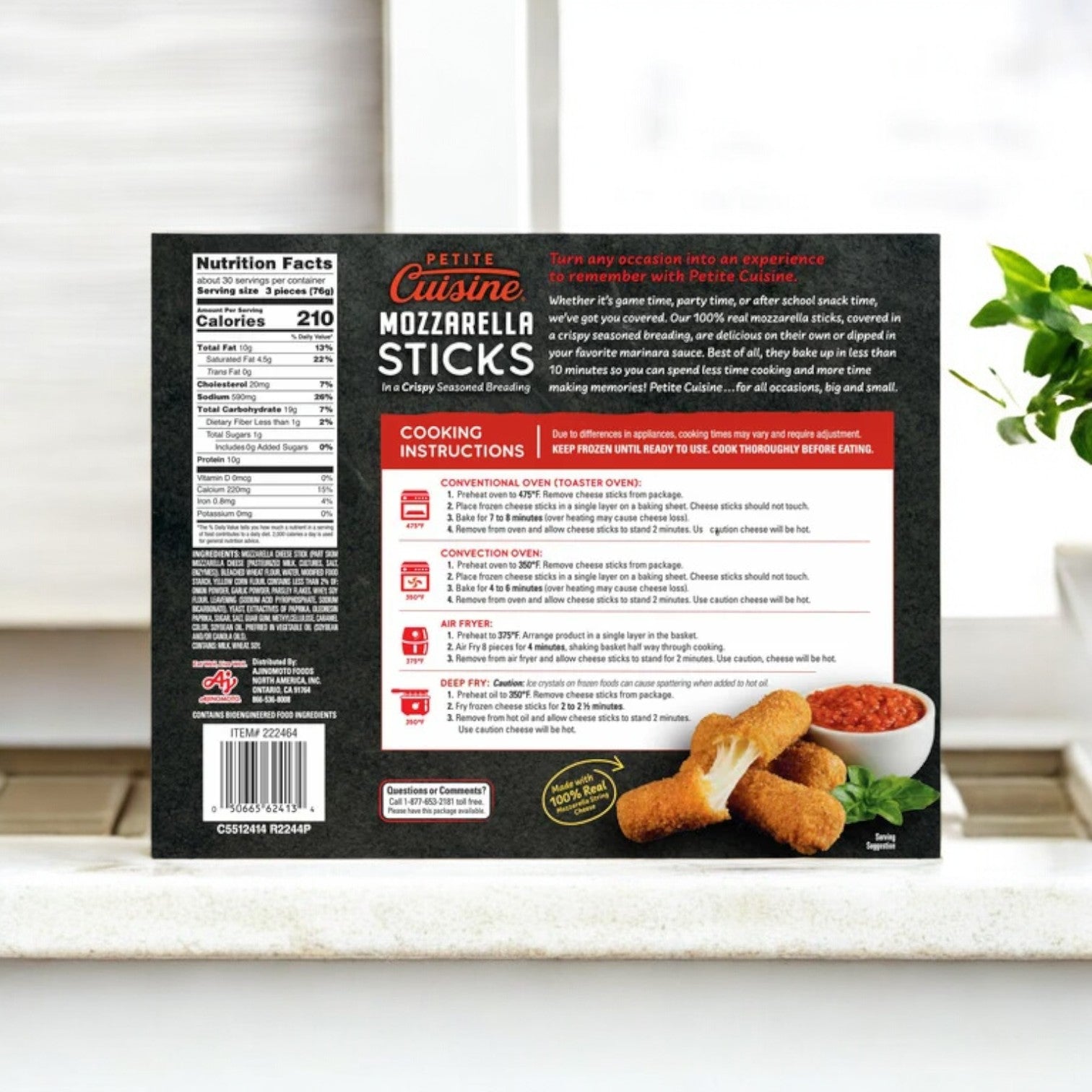 A box of Petite Cuisine Mozzarella Sticks, 5 lb-3 Count, is on the kitchen counter, highlighting nutritional facts and cooking instructions. Made with real mozzarella in a crispy coating, these sticks offer a delightful snack. A small plant adds charm in the background.
