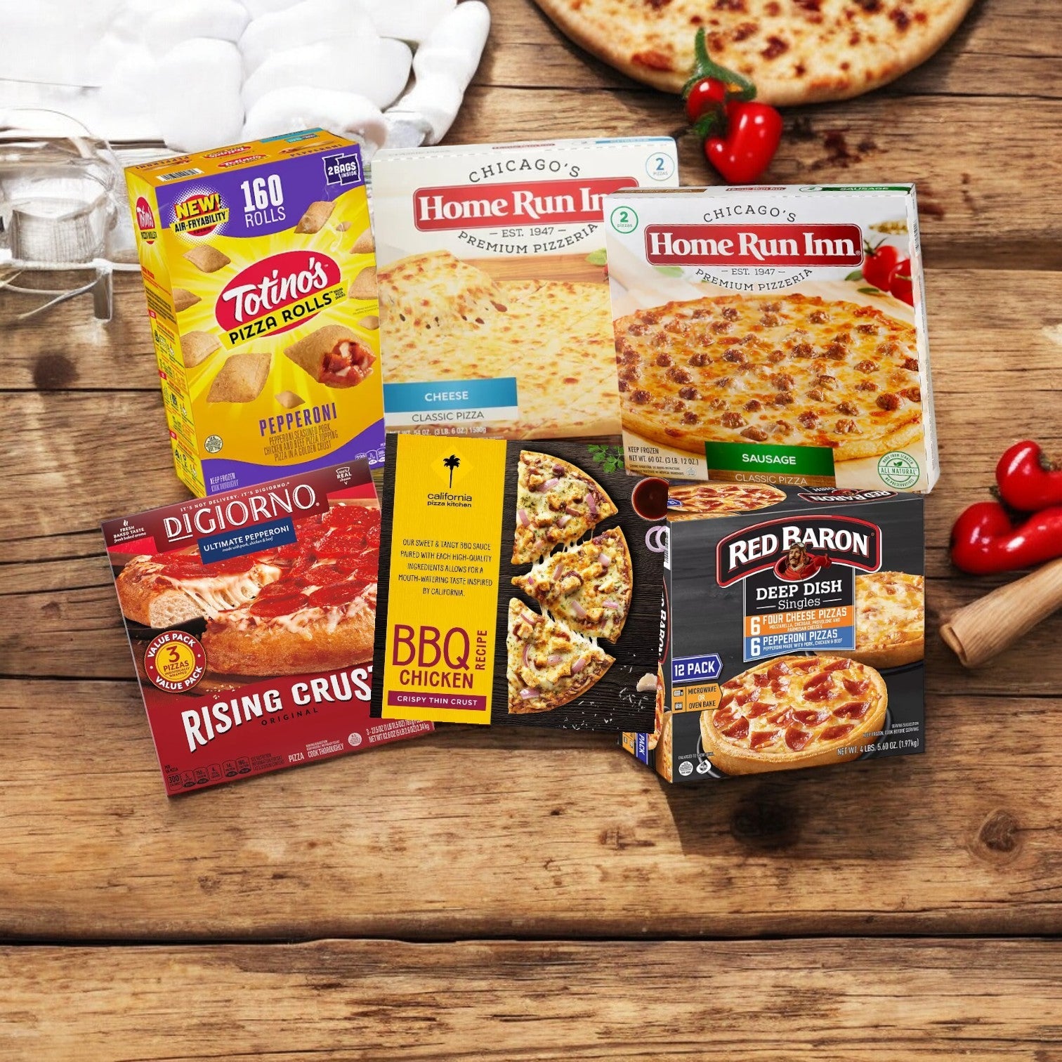 Displayed on a wooden surface are boxes of Totino's, Chicago's Home Run Inn, DiGiorno, and Red Baron frozen pizzas. The display includes Home Run Inn's Pizza Time Party Pack! 6 Total Boxes surrounded by fresh pizza ingredients.