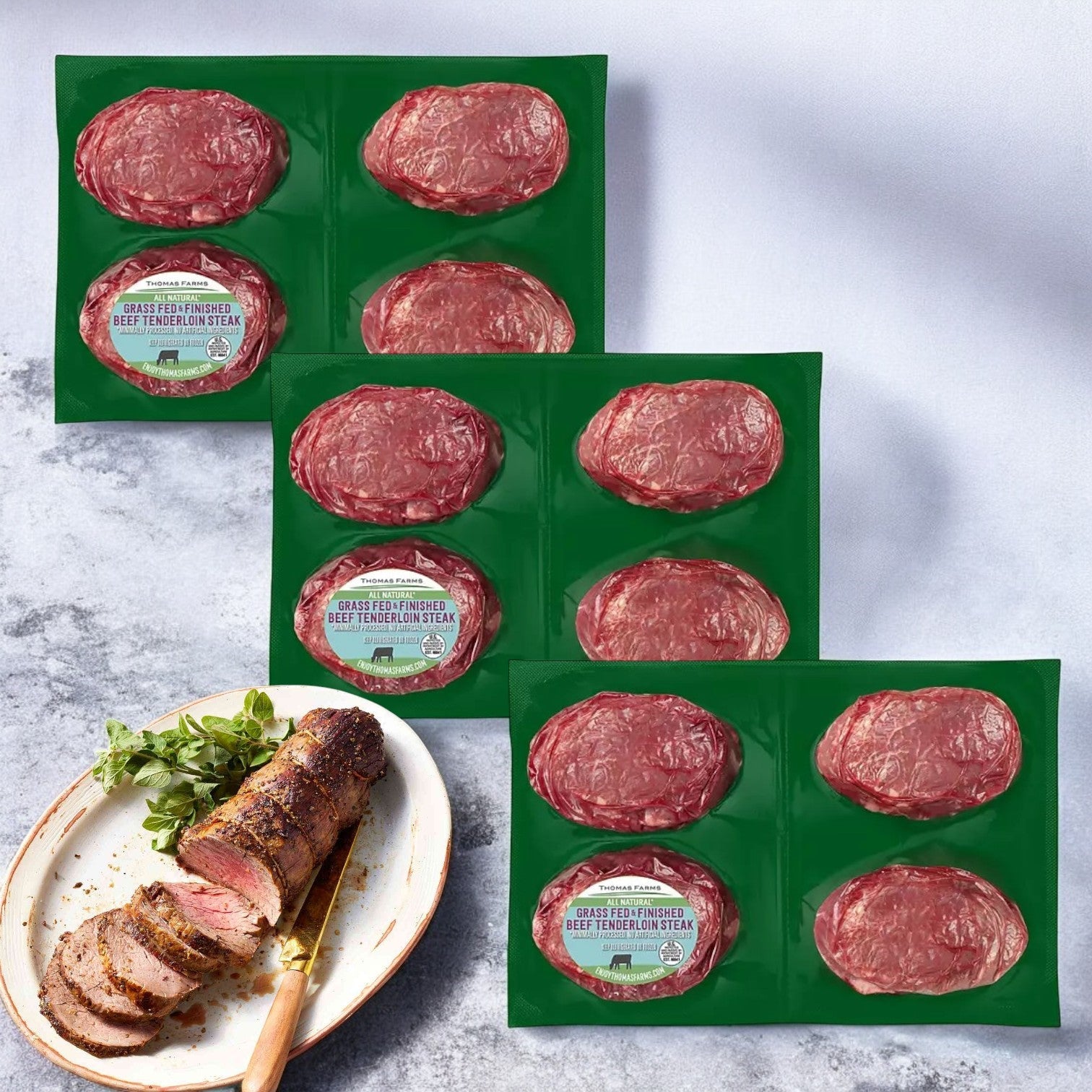 Enjoy an exquisite gourmet dining experience with Thomas Farms' Tenderloin Beef Steak. Each of the three packages includes four cuts of premium grass-fed beef, beautifully presented with cooked slices and garnish.