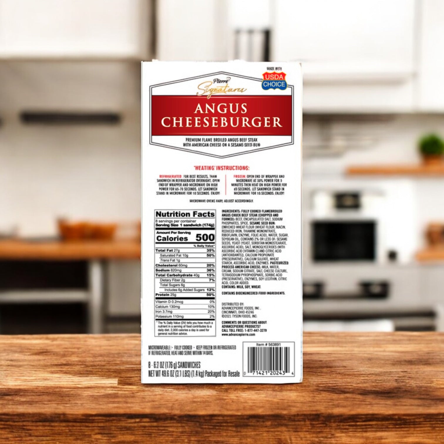 The back of a Tyson Pierre Signature Angus Cheeseburger 8 Count box shows nutrition facts, ingredients, and heating instructions for the individually wrapped burgers, with USDA Choice and Power Signature labels, resting on a kitchen counter.