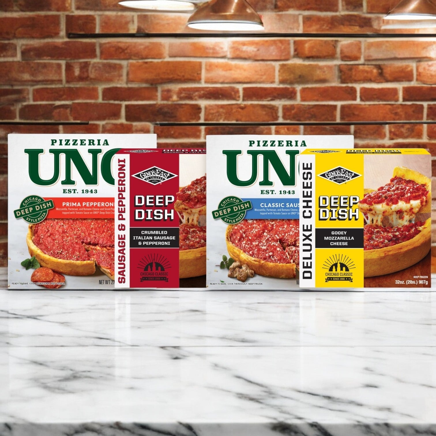 Three boxes of Easy Lunches' Chicago's Deep Dish Mix rest on a marble surface, featuring flavors like Sausage & Pepperoni, Pepperoni, and Deluxe Cheese. Perfect for anyone craving a rich and authentic Pizzeria Bundle with Chicago's signature flavors.