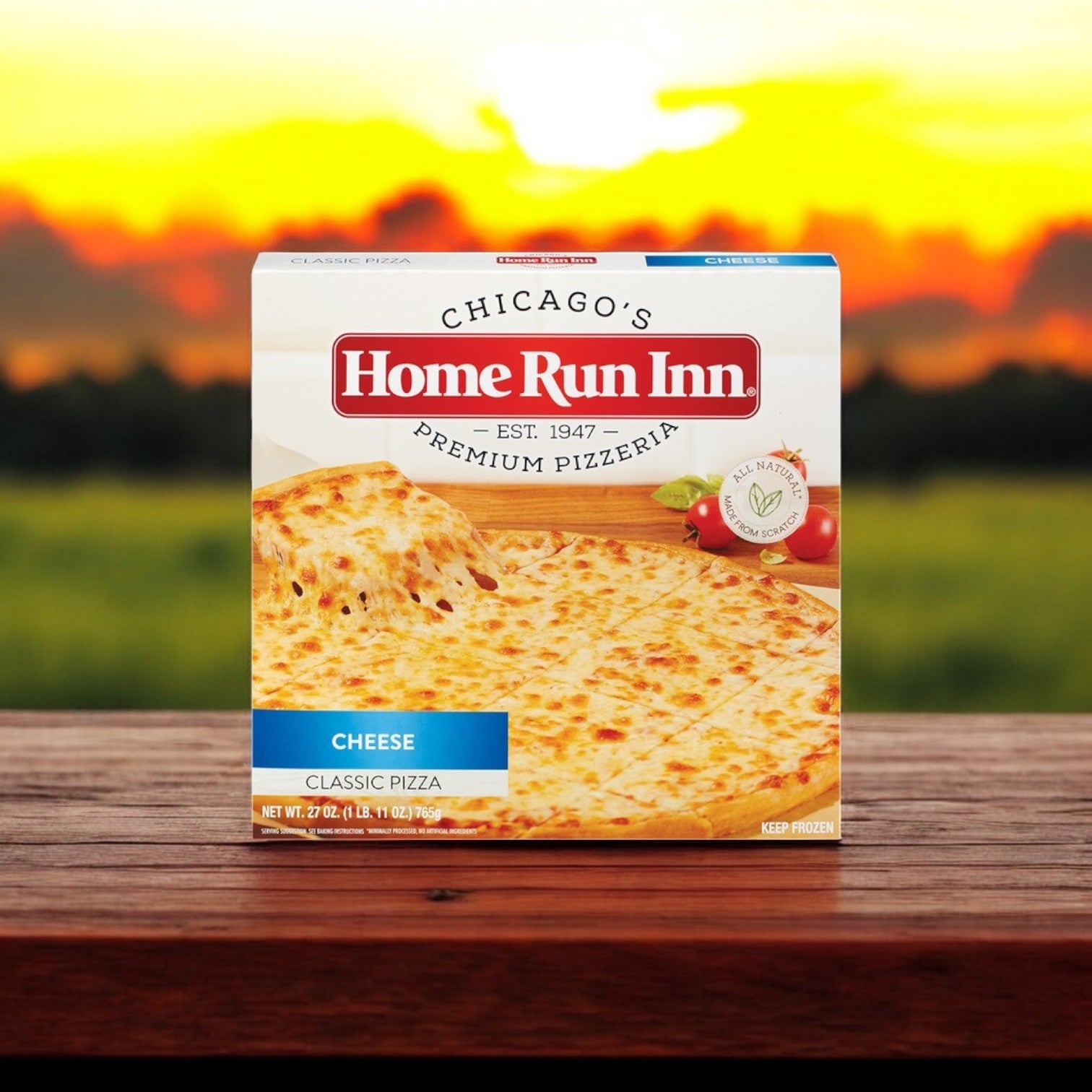 The Easy Lunches' Home Run Inn and Vienna Beef Chicago-Style Favorites Combo is showcased on a wooden table with a sunset in the background, embodying authentic Chicago-style flavors.