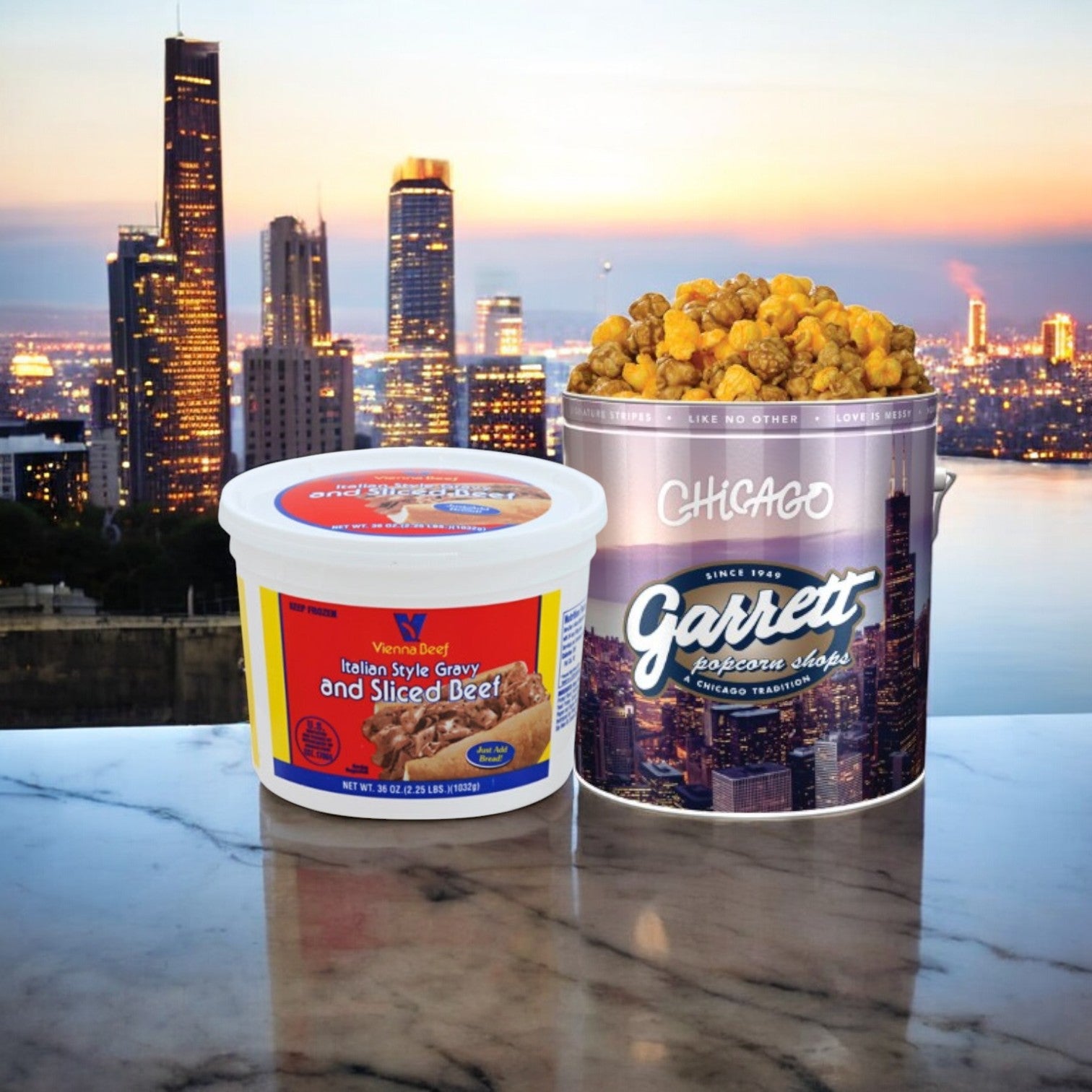 A Vienna Beef Italian Gravy & Sliced Beef + Garrett Popcorn Tin from Easy Lunches rests on a marble surface with a stunning city skyline backdrop.