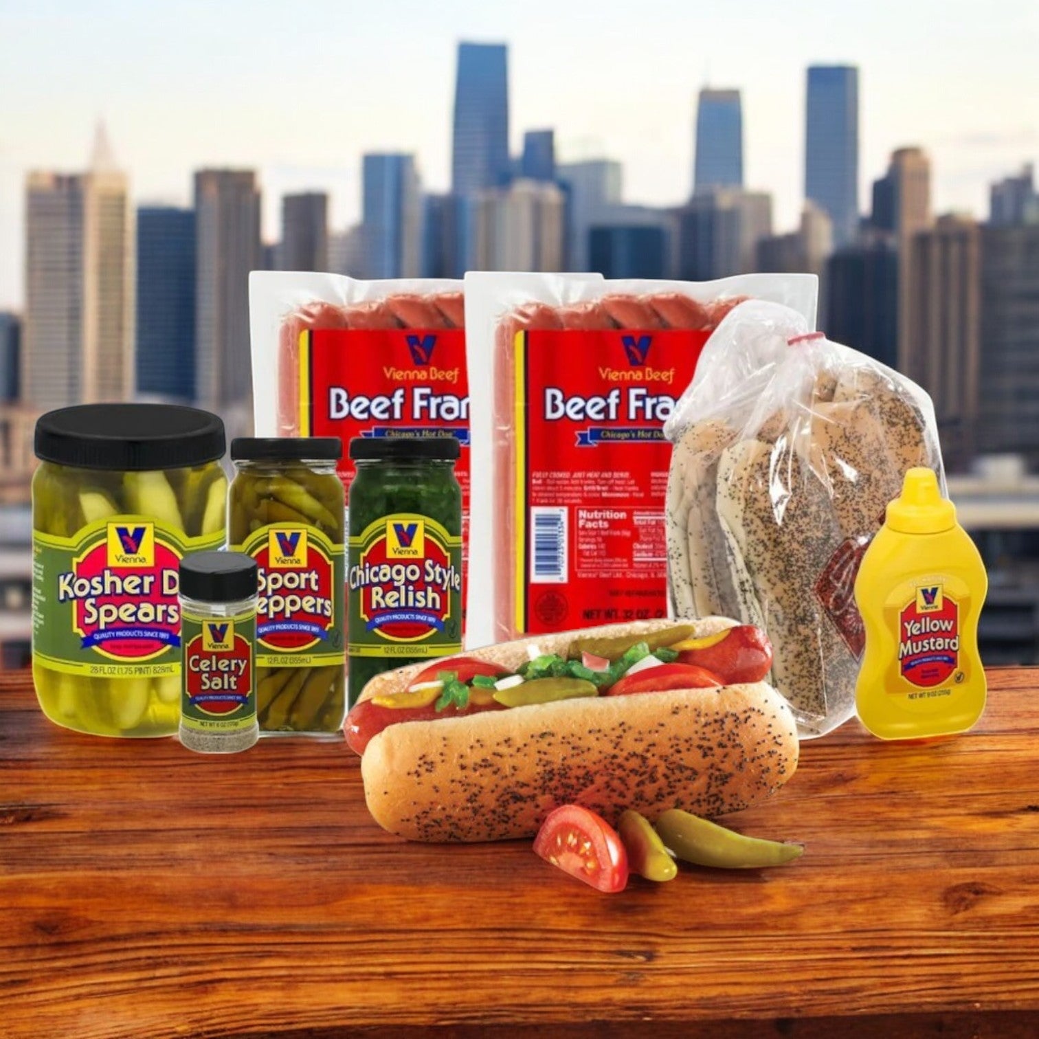 A Chicago-style hot dog from the Vienna Beef's "Vienna Hot Dog Kit! Chicago Style!" with 32 hot dogs, condiments, and buns is displayed against the city skyline. The setup includes pickles, relish, fresh buns, and Vienna Beef Hot Dogs packages.
