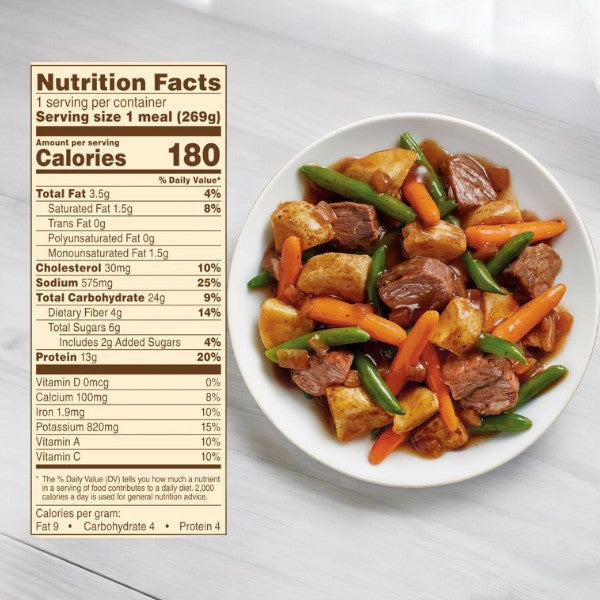 The College Meal Pack by Easy Lunches offers a nutritious stew with hearty meat, carrots, green beans, and potatoes on a white surface. The nutrition facts label confirms it's an ideal quick and healthy meal for hungry college students.