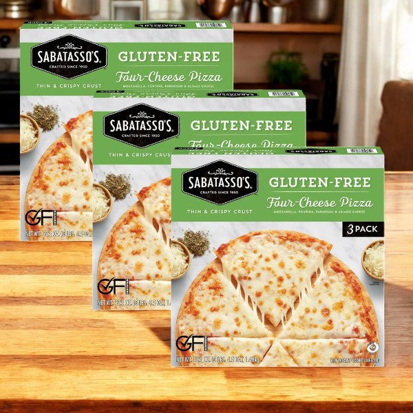 Three boxes of Sabatasso's Four Cheese Pizza, featuring premium cheeses and a stone-baked crust, are displayed on a wooden table.