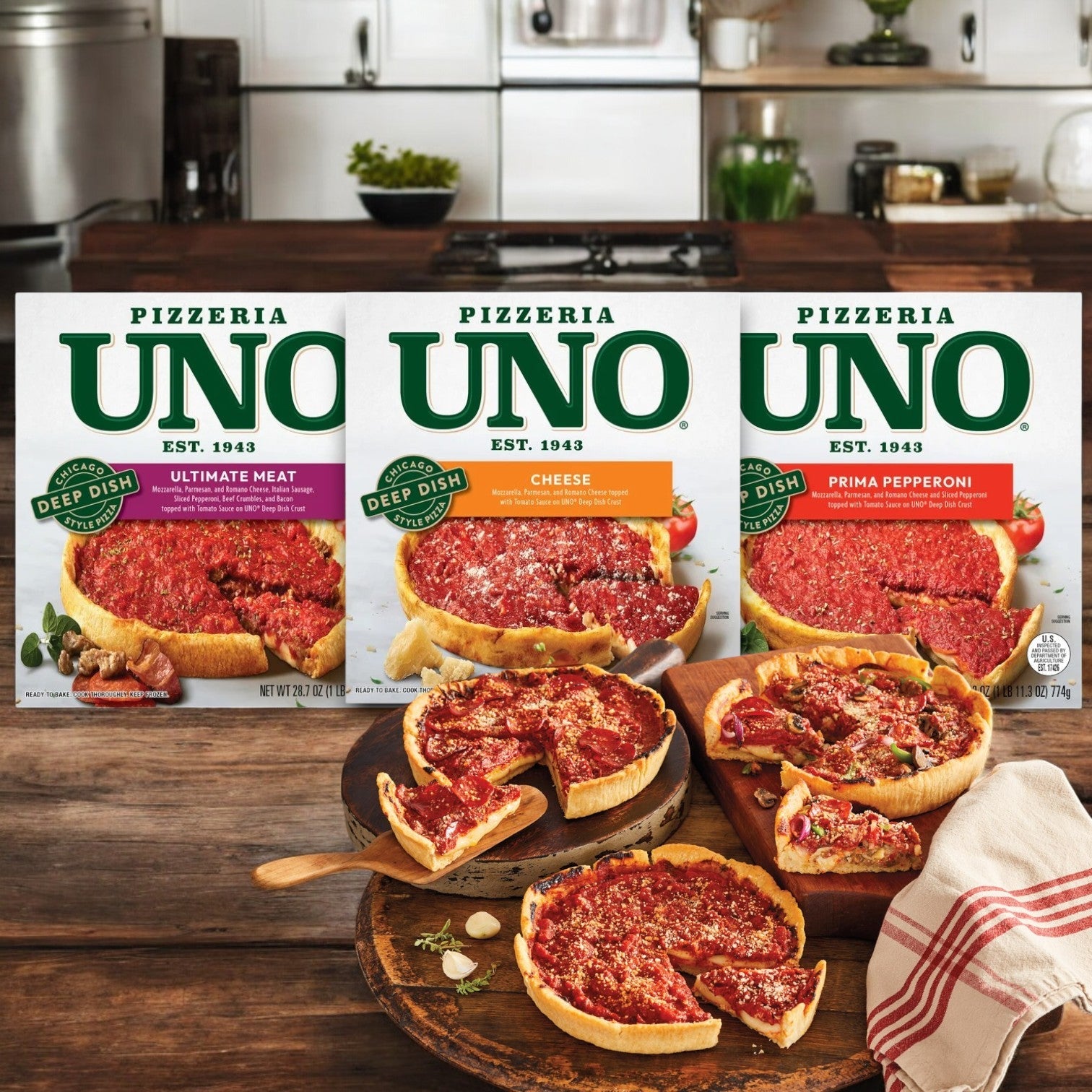 Three boxes of Pizzeria Uno Deep Dish Combo Pack- 3 Items Total! featuring Ultimate Meat, Cheese, and Prima Pepperoni are beautifully displayed behind delicious sliced pizzas on a wooden table in a cozy kitchen.